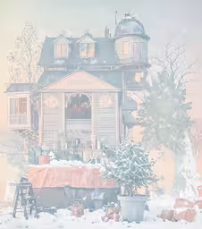 a large house with many windows in the snow,a house in winter with lights shining
