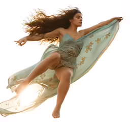 a beautiful woman wearing a green dress flying through the air
