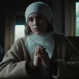 the nun holding her hands in prayer