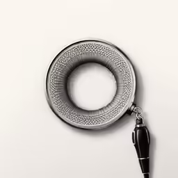 a black and white photo of a hook with a pen
