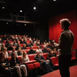 an audience at a movie theater watching a performance