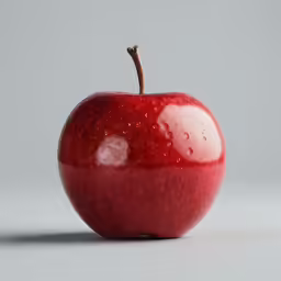 an apple is shown with water drops on it