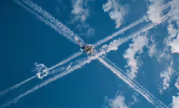 a group of jets flying through the sky