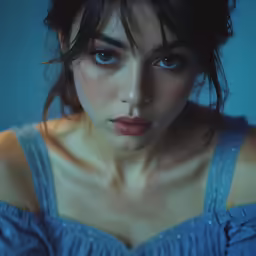 the woman is dressed in blue for this photo
