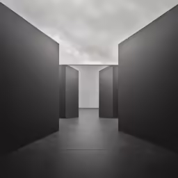 some black pillars and one is a person walking