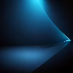 light streams down to the floor of a black room