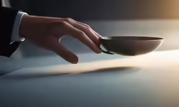 the hand that reaches into the empty bowl