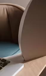 an apple laptop computer on top of a wooden desk