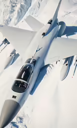 an airplane is flying low over some snow