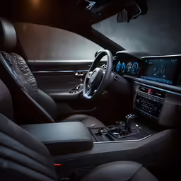 interior view of bmw x4 showing dash with a screen, steering wheel, and dashboard