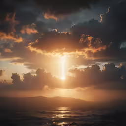the sun shines on the ocean as it peeks through some clouds