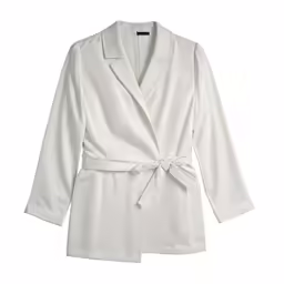 a white jacket with an open shoulder and a sash