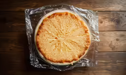 a cake sitting on top of a plastic bag