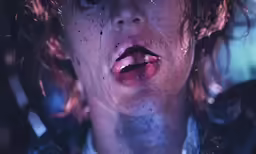 a close up shot of someones mouth covered in dirt