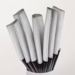 a close up shot of some metal tubes in a cup
