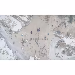 the word is written in black writing on the snow covered ground