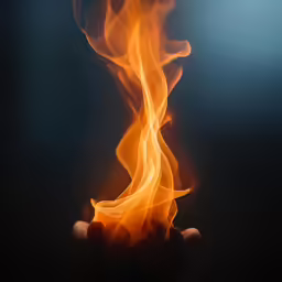 hand holding fire and water on a dark background