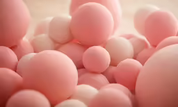 a large amount of pink and white bubbles
