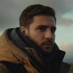 there is a man that is outside with a beard
