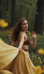 a woman in a yellow skirt walking through a forest
