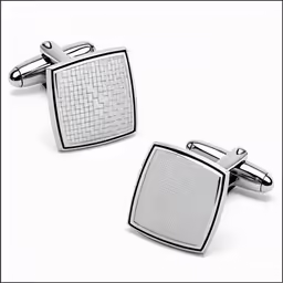 two cufflinks with woven pattern on them