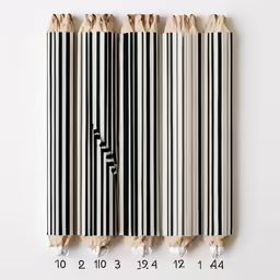 a line of different sized papers are lined together