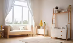 a room with wood flooring and white furniture