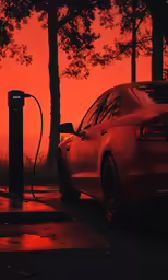 a red car plugged into a charging station