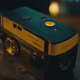 an old style camera sitting on top of a counter