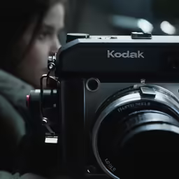 a woman with long dark hair is taking a picture