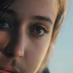 a close up of the eyes and upper half of a person