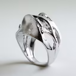 a silver ring with two pieces of glass in it
