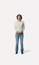 an african american woman is standing wearing jeans