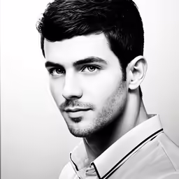 a man that is looking straight ahead with a nice face