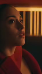 a young woman is looking straight ahead