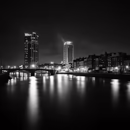 a black and white photo of the city at night