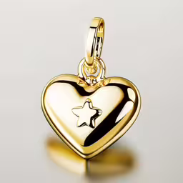 gold charm that has a star shaped like a heart,the star in a heart pendant is gold