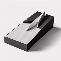 a black and white photo of paper on top of a shelf