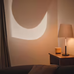 a lamp that is next to a table