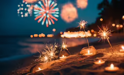 some lit up sparklers on a beach with the fireworks