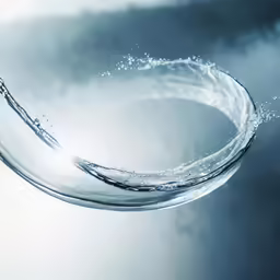 water droplets making an interesting circular design with the water flowing over it