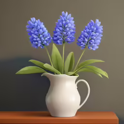 a white jug is holding blue flowers on a table