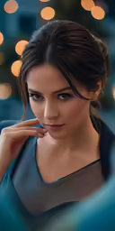 a beautiful young woman in a dark blue top