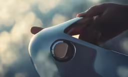 person holding the top of an electric vehicle