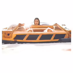 a woman in a fake car is next to a man