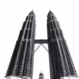 three buildings with a large tower next to them