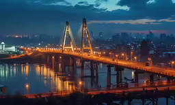 a bridge with lights is shown over the water