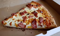 the pizza is missing some slices of topping