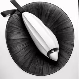 a black and white drawing with a knife and an egg