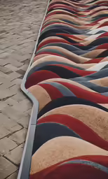 a long section of rugs on the sidewalk outside